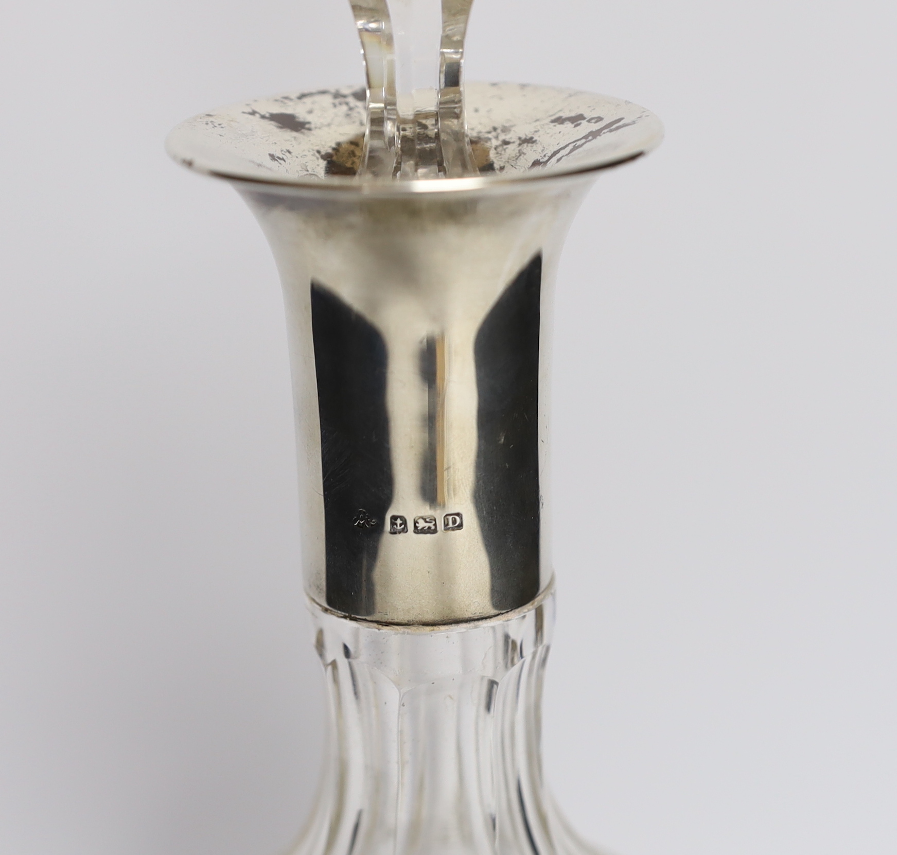 A silver mounted glass decanter, Birmingham 1928, 35cm high (a.f.)